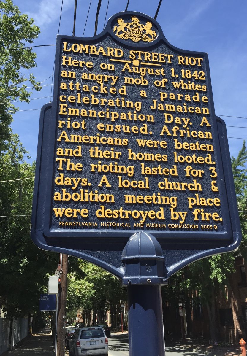 Image of the street marker honoring the Lombard Street riot.