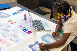 A girl working on a poster