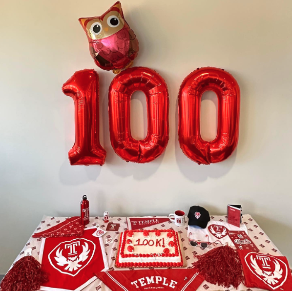 Temple merch and balloons celebrating 100,000 Instagram followers