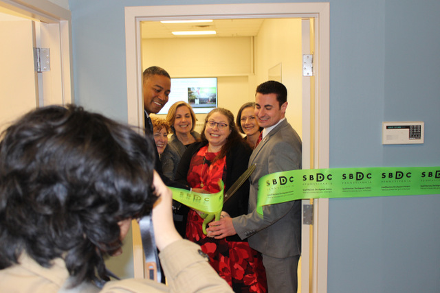 Ribbon being cut at the Small Business Development Center