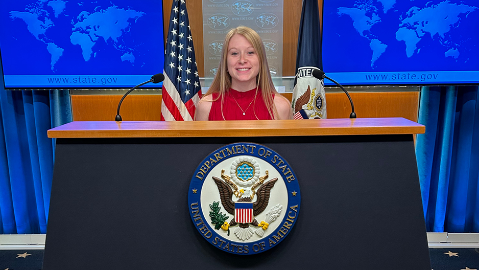 Mergen at State Department podium