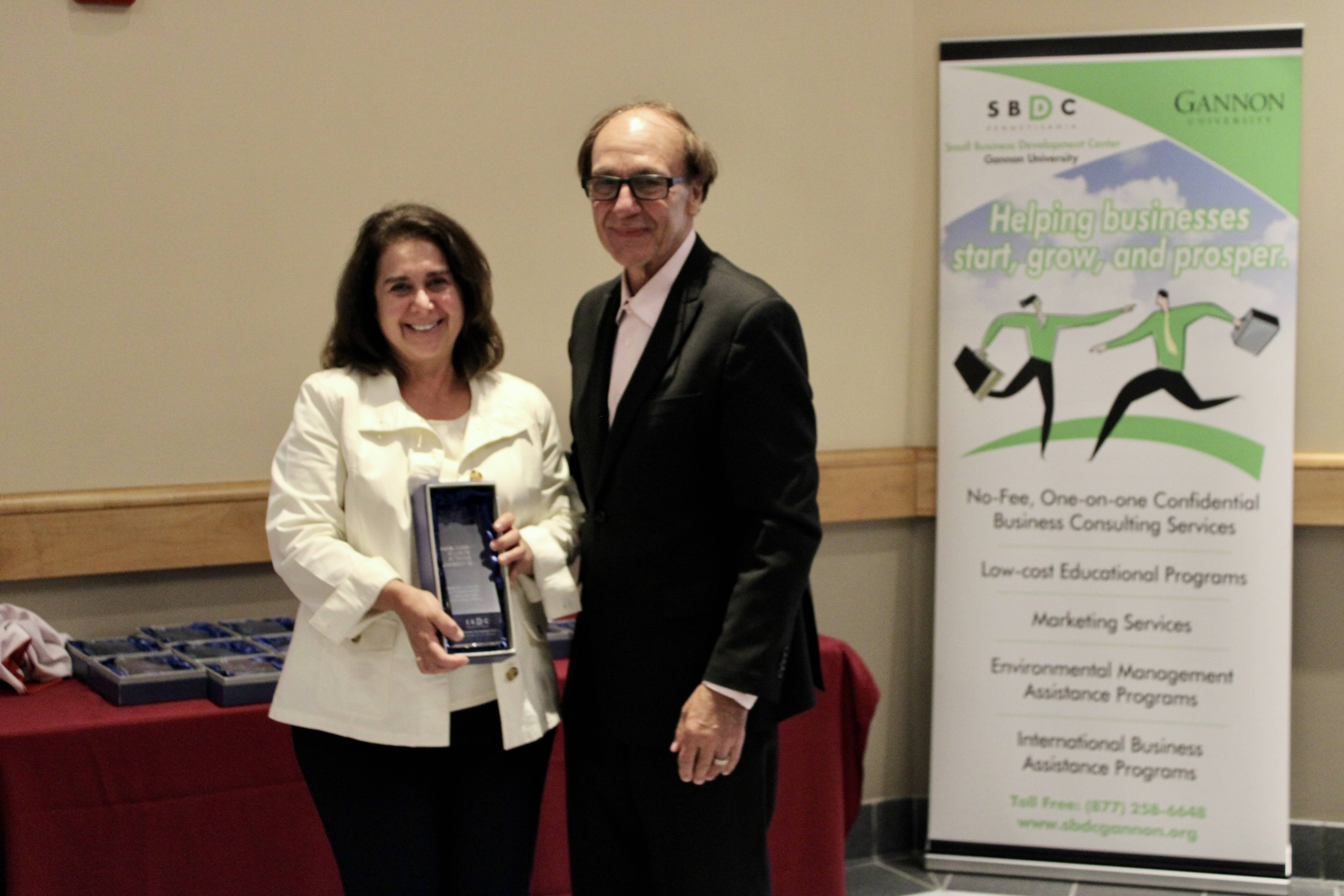  Janice Crile accepts the 2023 Game Changer award from the Pennsylvania Small Business Development Centers lead office.