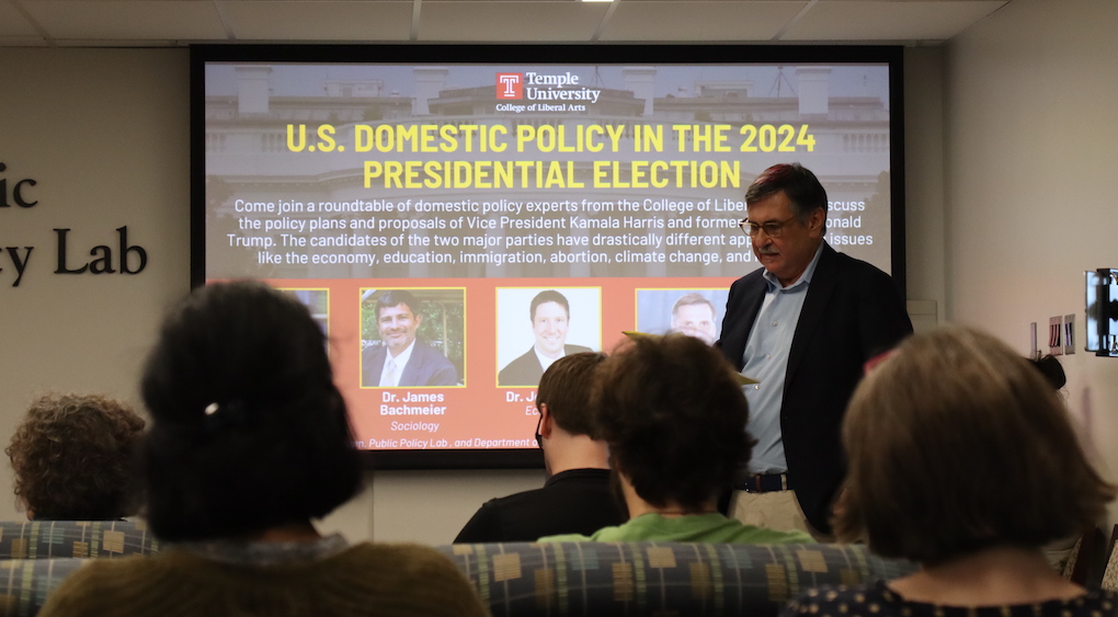 image of Gary speaking to a crowd at the Public Policy Lab