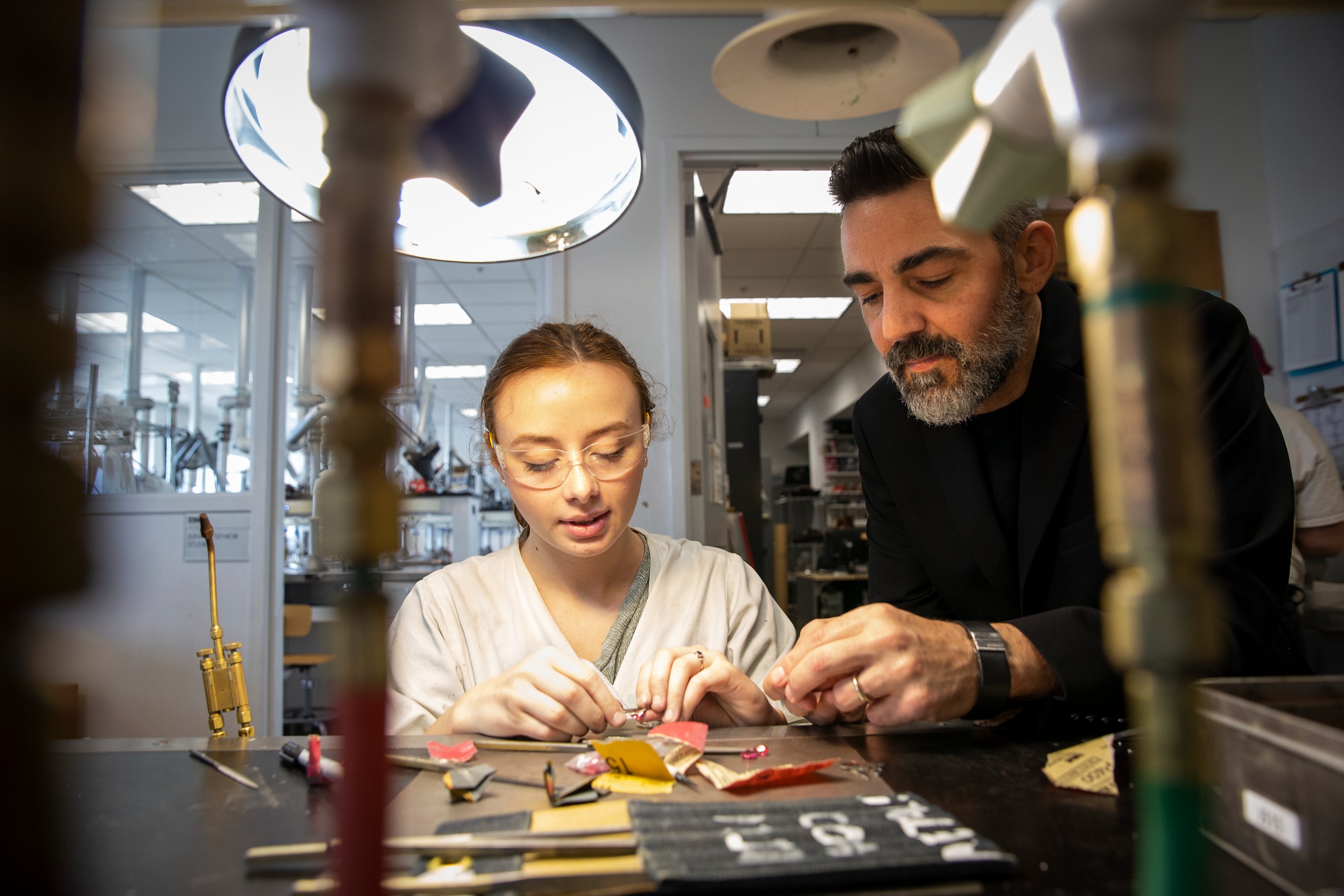 Image of MJCC program head Doug Bucci working with a student.