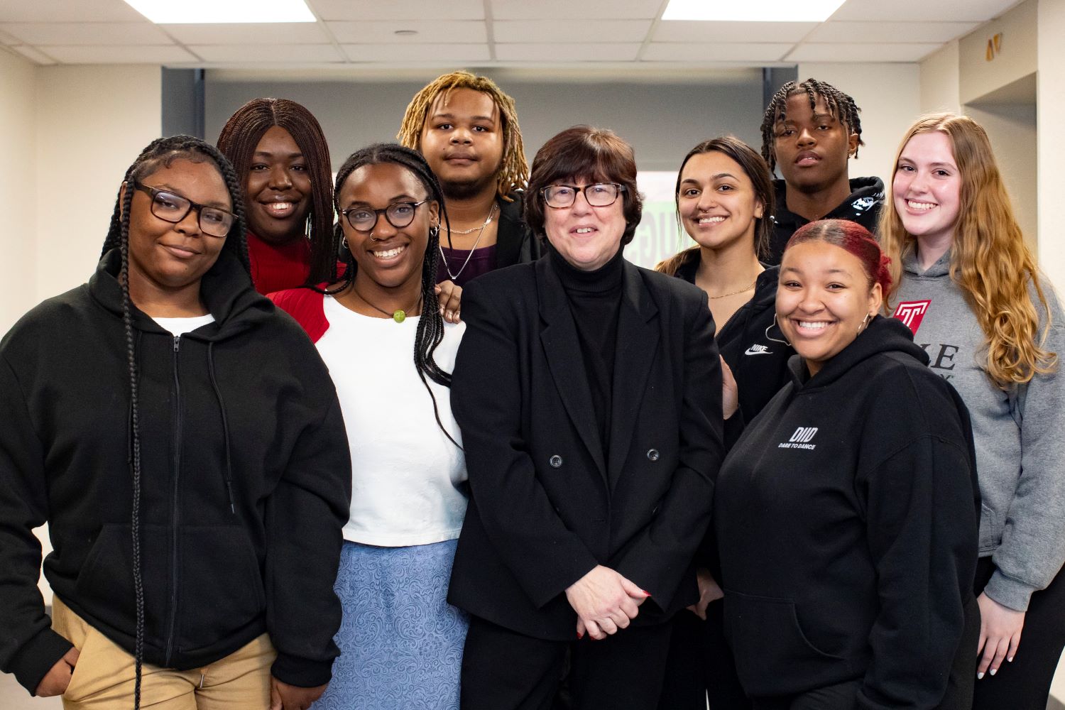 Tricia Jones (center) interacts with interns and students from Resolutionary Partners, the program she created to decrease violence in Philadelphia. From left to right: Nae Brown, Tosin Sanni, Nya Jarboe, Dante Harrell, Tricia Jones, Katie Weissenberg, Javon Clements, Ciara Chase and Carissa George. 