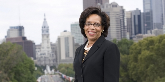 Temple Law School Dean JoAnn Epps with City Hall in the background.