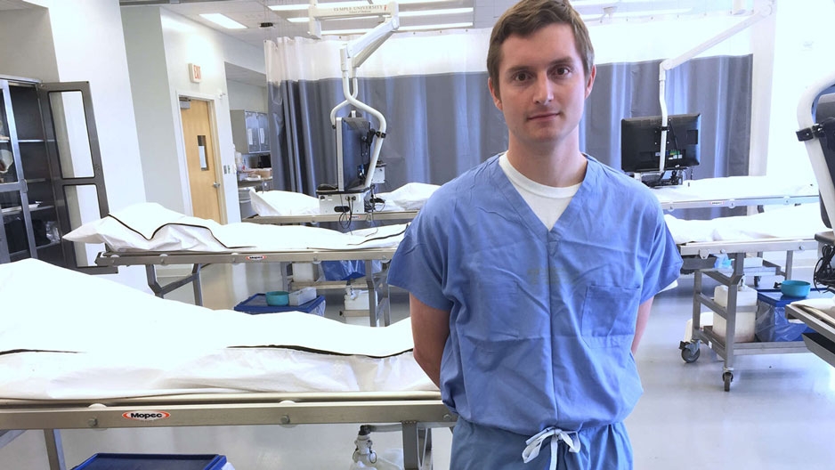 medical student Michael Rockman standing in a lab.