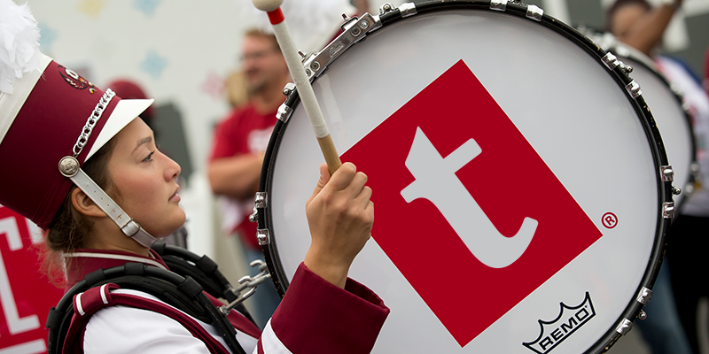 A drum that shows Temple’s updated lowercase “t” logo. 