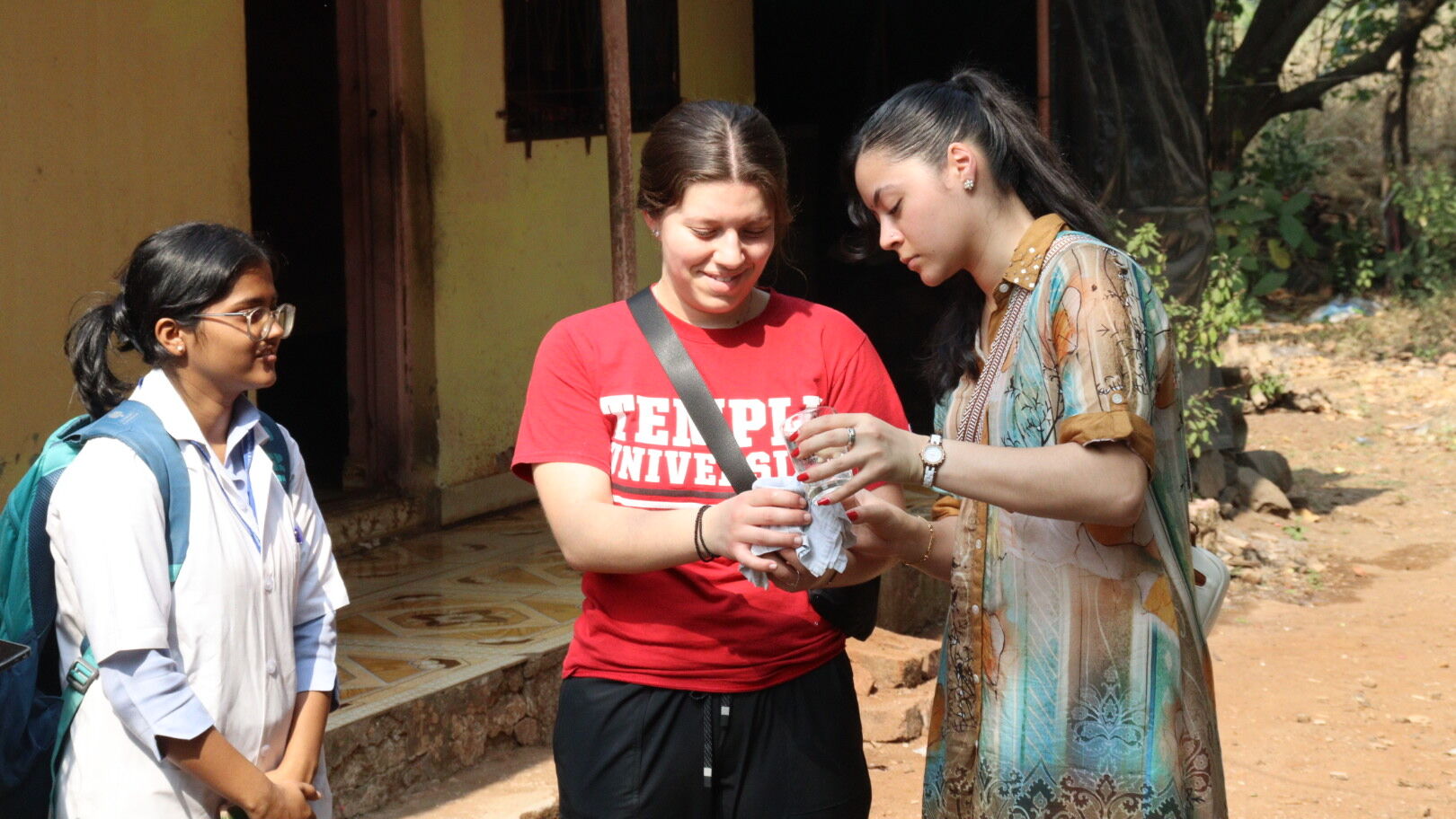 Temple and MGM students conducting a water treatment activity