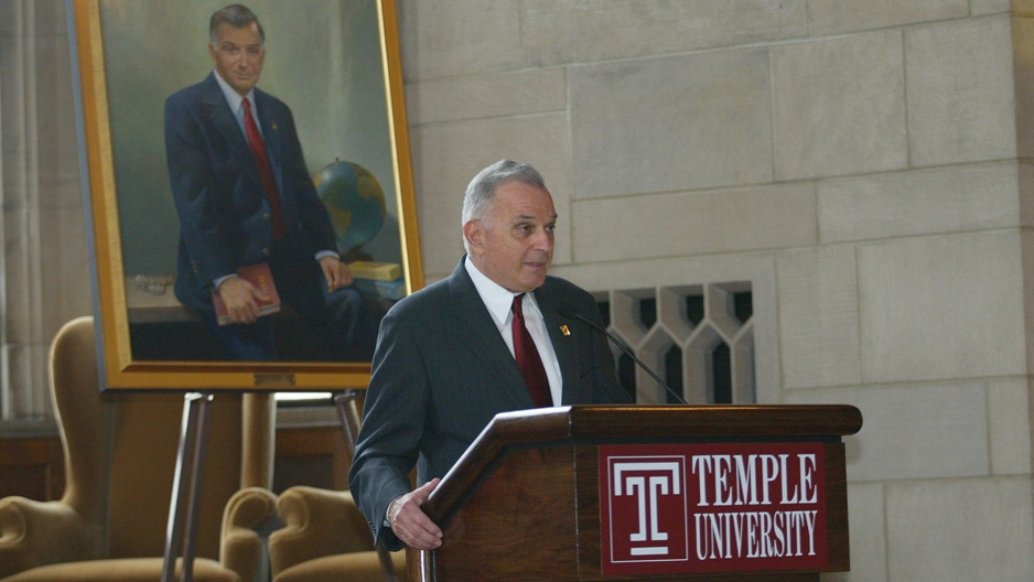 Temple's seventh President Peter J. Liacouras standing at a podium.