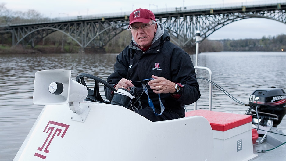 Coach Gavin White wearing a Temple baseball cap.