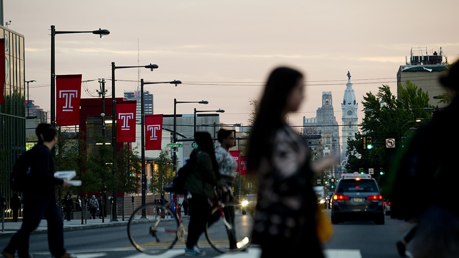 Temple flags on Broad Street with a view of City Hall. 