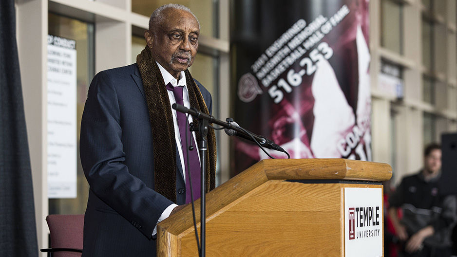 Former men's basketball Coach John Chaney standing at a podium.