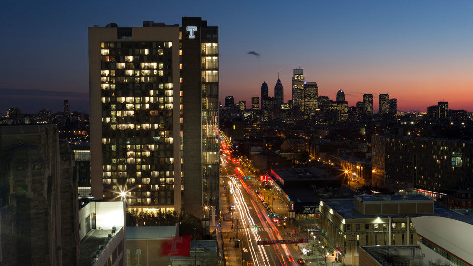 Morgan Hall at night with skyline in the background