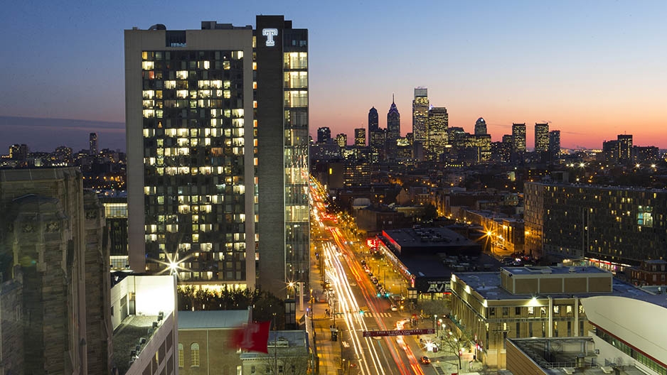 Morgan Hall and the Philadelphia skyline at sunset.