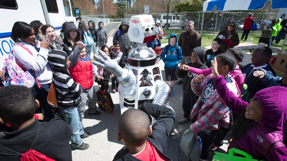 children smiling as they watch a robot at Temple Ambler EarthFest.