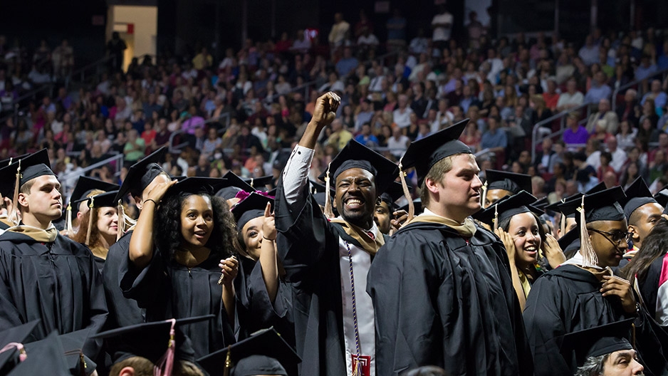 Graduates celebrating at Temple's Commencement ceremony.