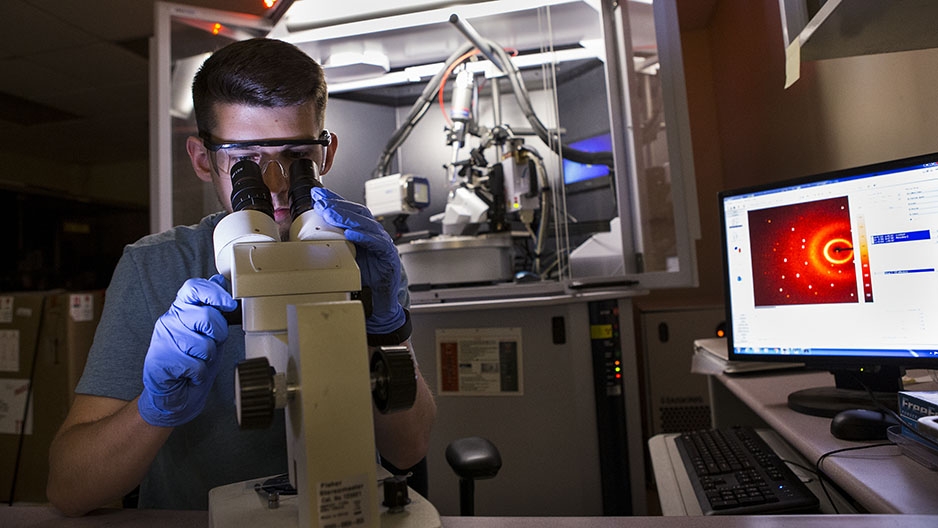 A Temple researcher working in a lab