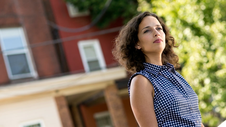 Temple University graduate Yasmine Mustafa standing outside on campus.