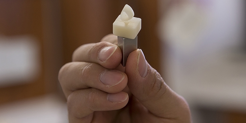 A tooth crown during the milling process.