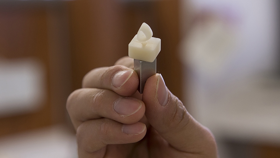 A tooth crown during the milling process.