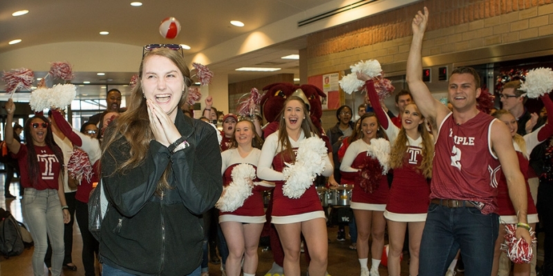 A woman being surprised in a Temple University residence hall.