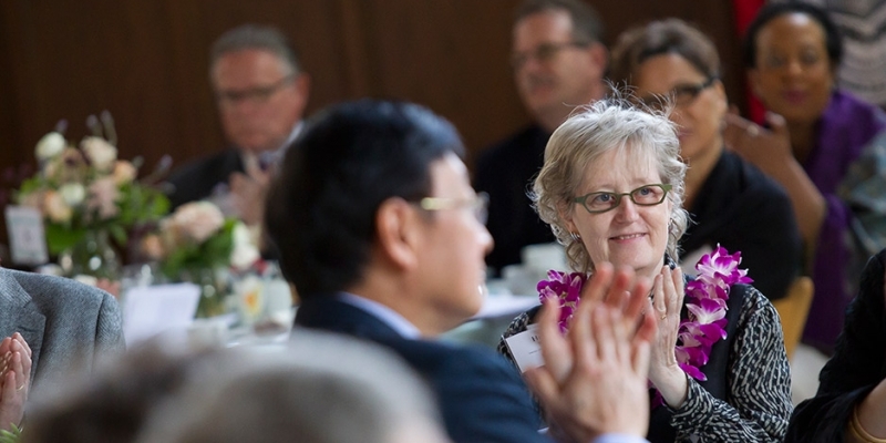 A female faculty member applauding during Temple’s Faculty Awards Luncheon.