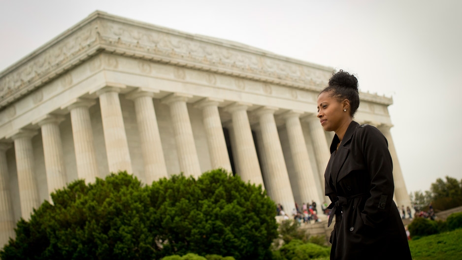  Temple graduate Jamira Burley standing in front of the Lincoln Memorial. 