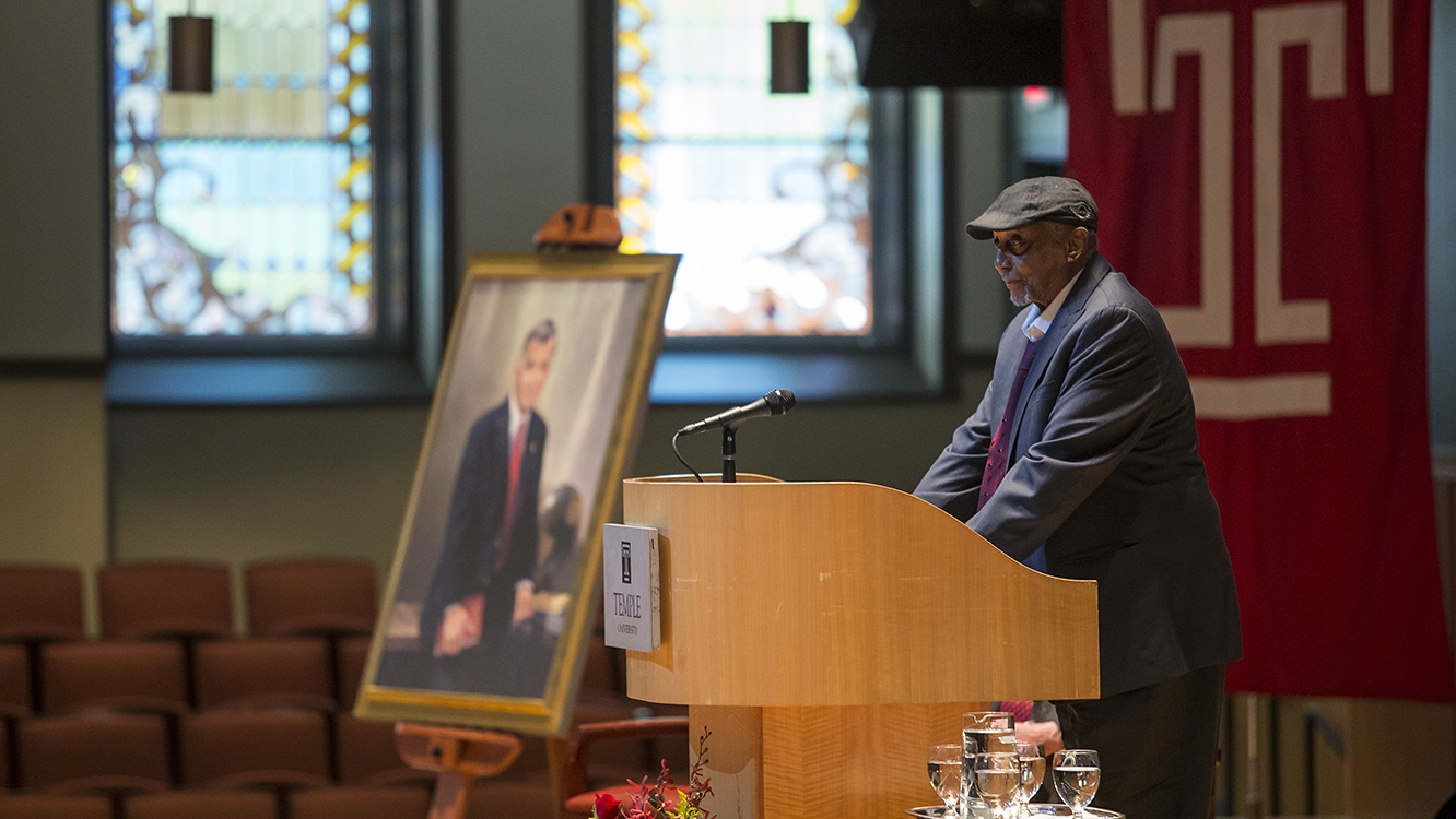 John Chaney speaks at a lectern at a service for Peter J. Liacouras.