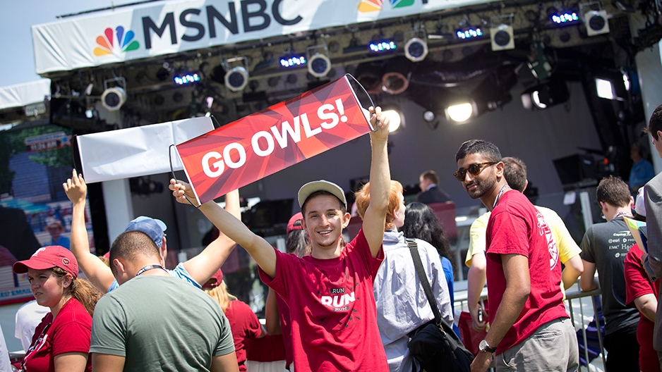 Temple students on an MSNBC set with banners and Temple t-shirts.