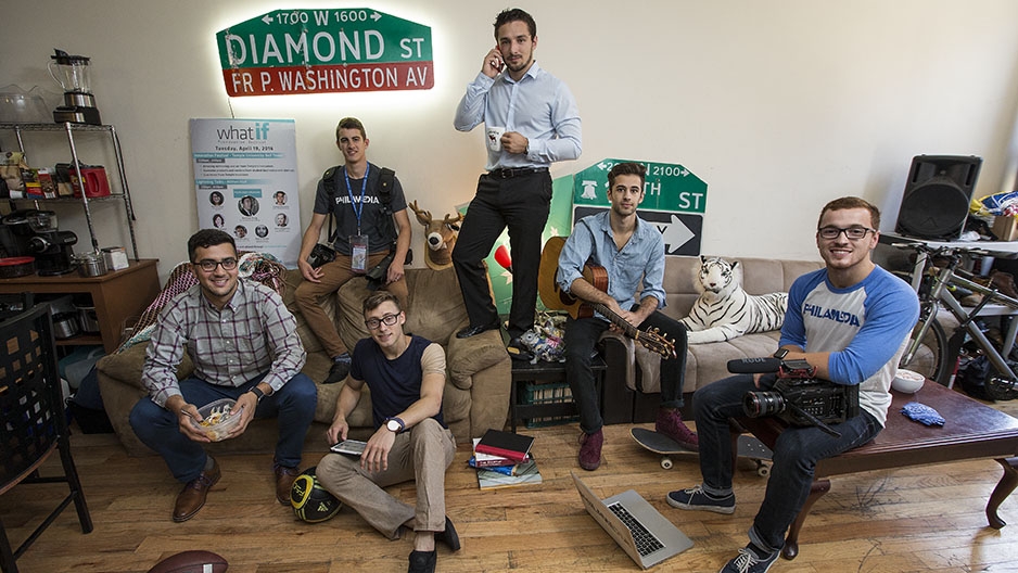 The six friends outside of their house on Diamond Street. 