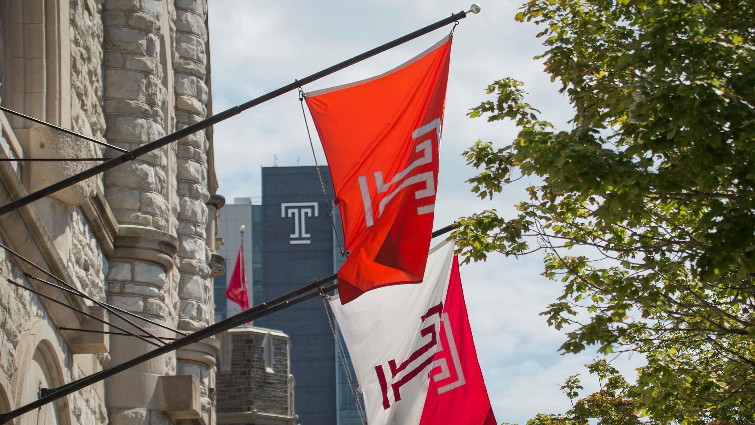 Temple flags flying on campus.