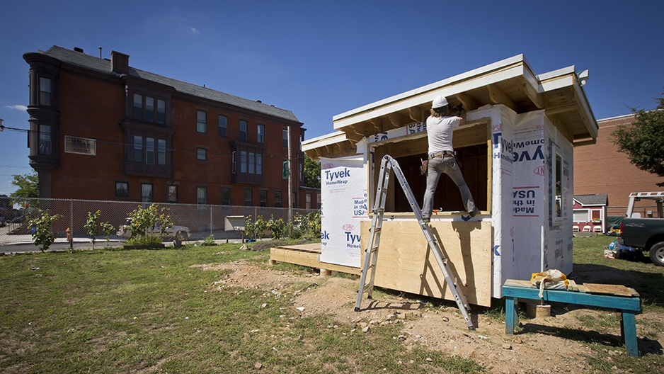 A construction worker working on the tiny house. 