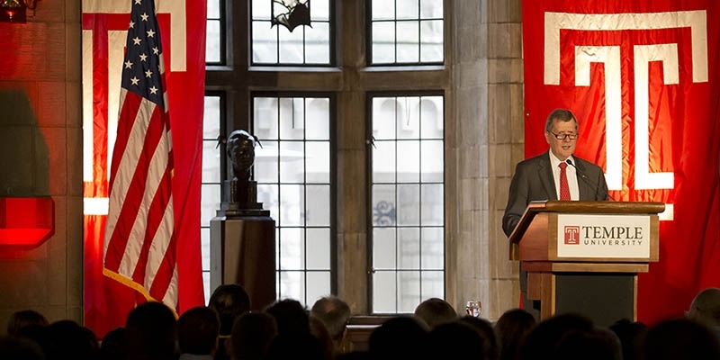 President Richard M. Englert standing at a podium and talking. 