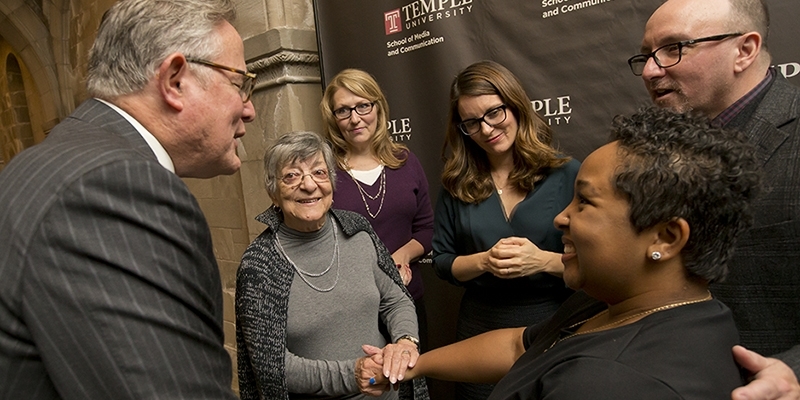 Student Ashley Rodriguez smiling as she meets Tina Fey and others.