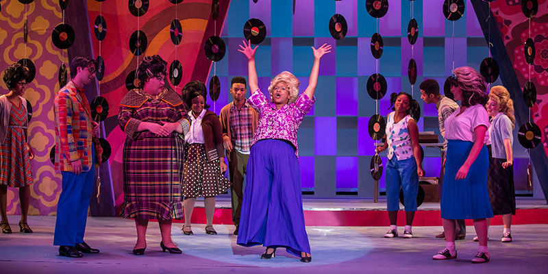 Actors in costume on the set of Temple Theaters's production of Hairspray.