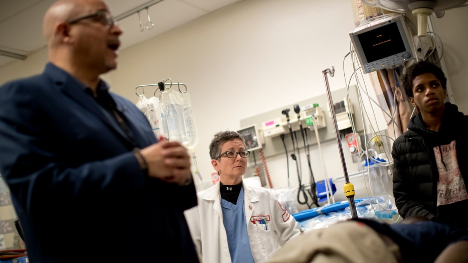 Amy Goldberg and Scott Charles speaking to students in a trauma bay.