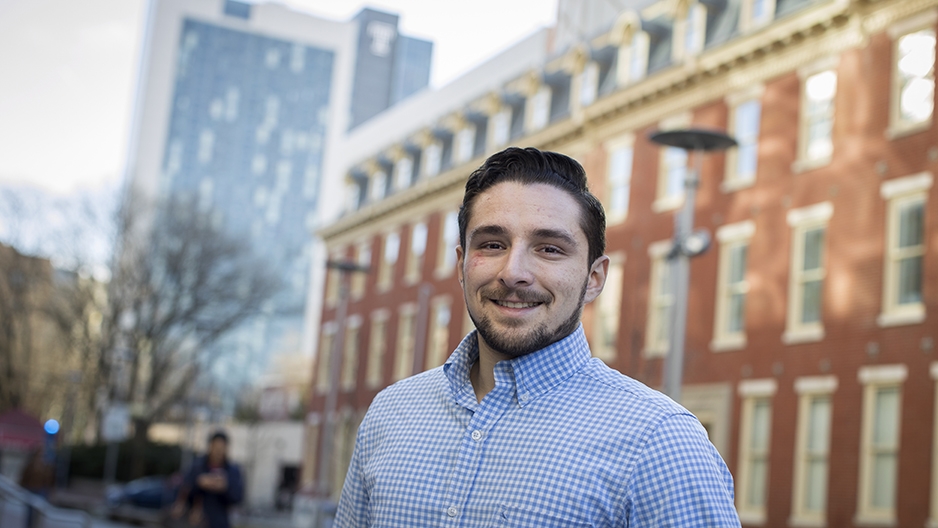 Jesse DiLaura standing on campus.