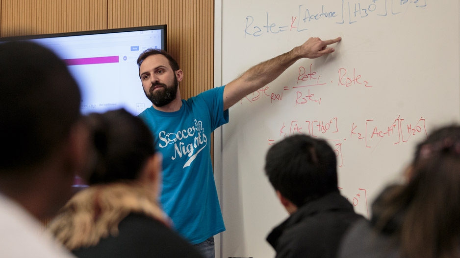 Assistant Professor Daniele Ramella pointing to a whiteboard while teaching.