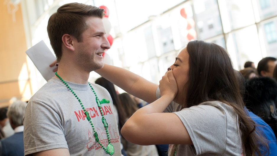 Temple med students Chris Kyper and Becky Lacayo reacting to their residency matches.