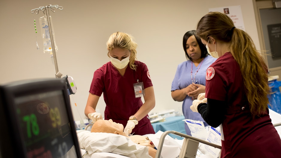 Nursing students working during a simulation