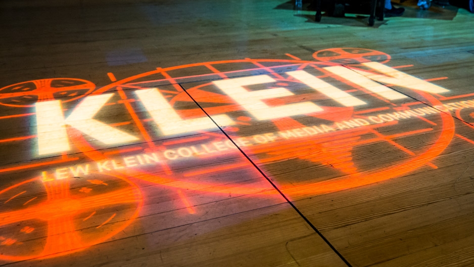 Klein College’s logo projected onto a stage