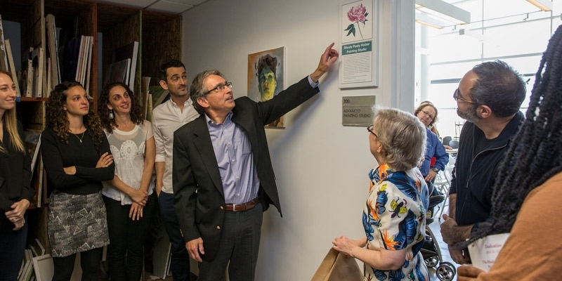 Stuart Holzer unveiling a plaque dedicating a painting studio to his wife