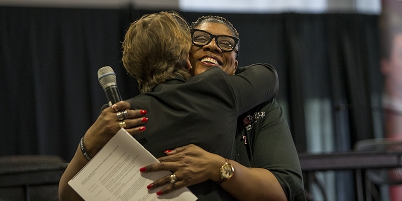 Laura Reddick hugging a woman.  