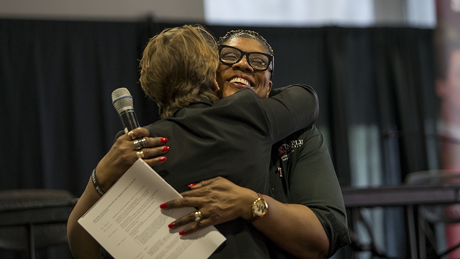 Laura Reddick hugging a woman.  