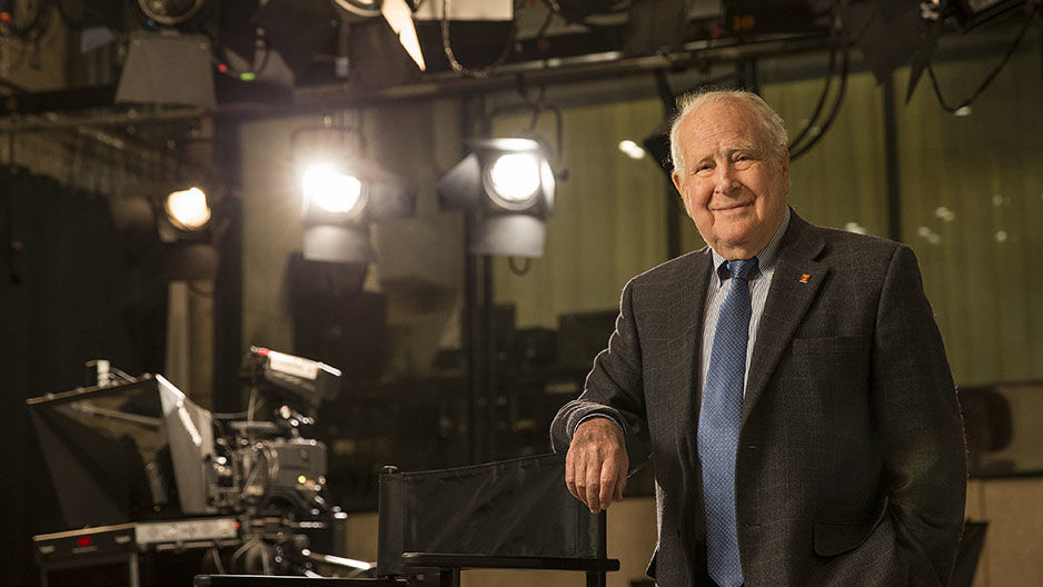 Lew Klein standing in a television studio