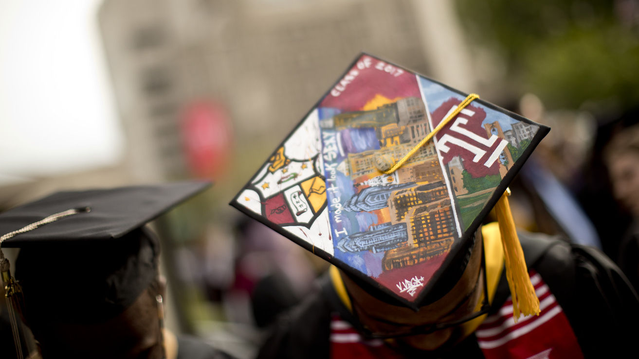 Image of a Temple graduate in their cap.