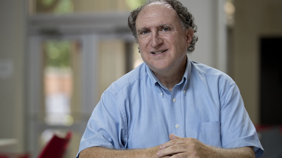 Larry Atkins sitting in the Student Center