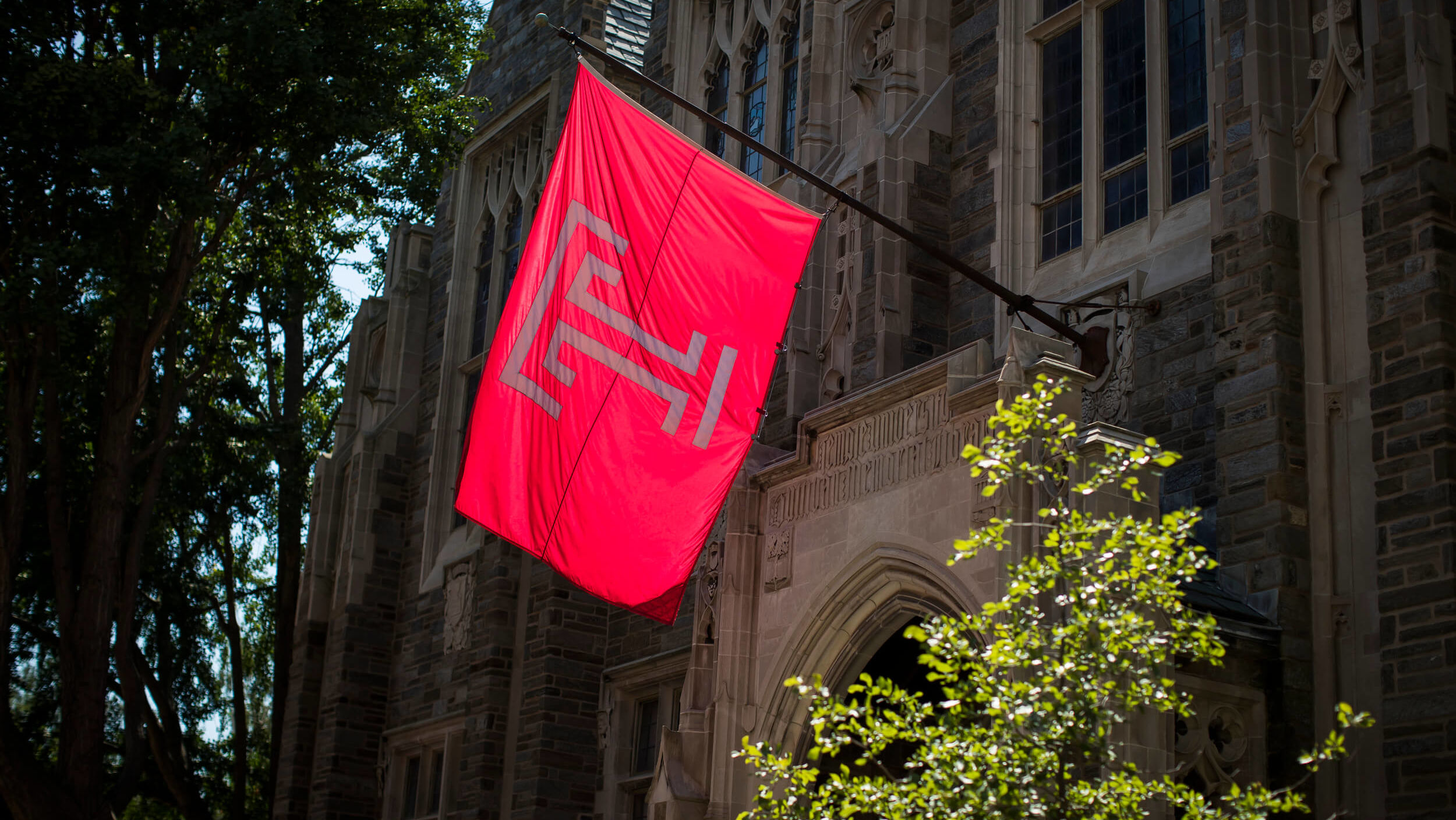 The Temple flag flies outside Sullivan Hall.