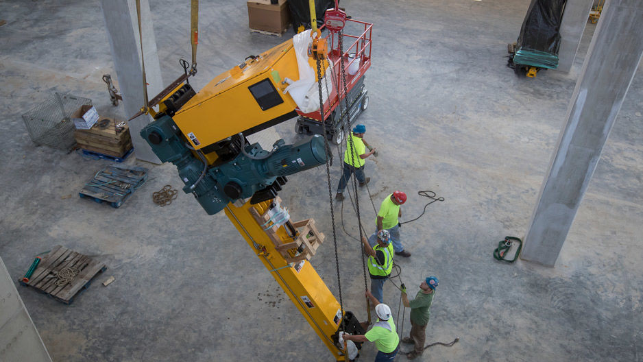 The robotic book retrieval and delivery system is lowered into the new library.